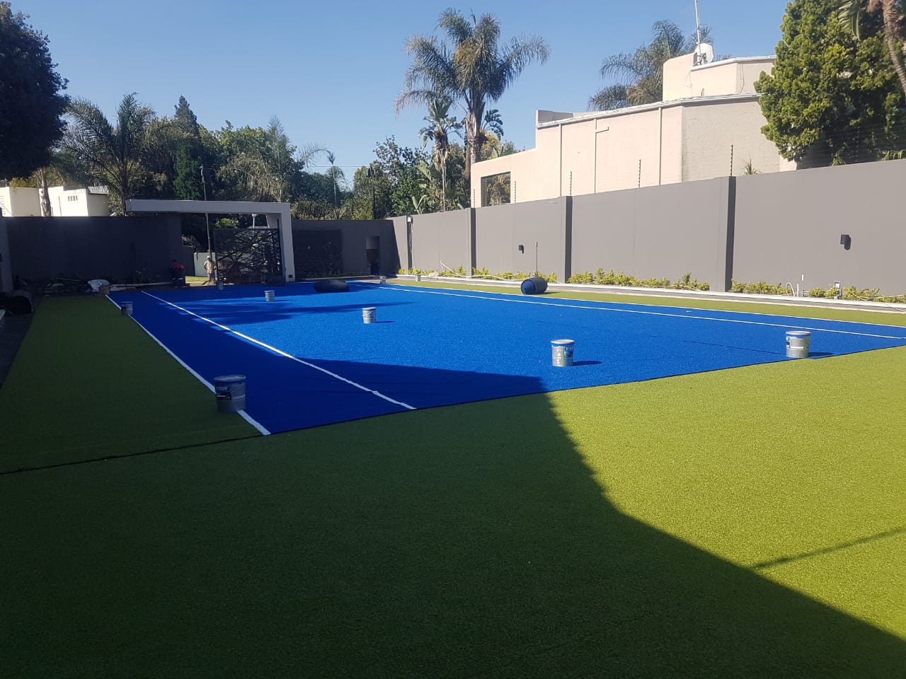 Artificial grass tennis court installation - Logan